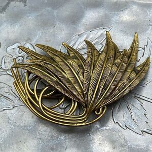 Vintage large ornate plume brooch . Antique brass finish .